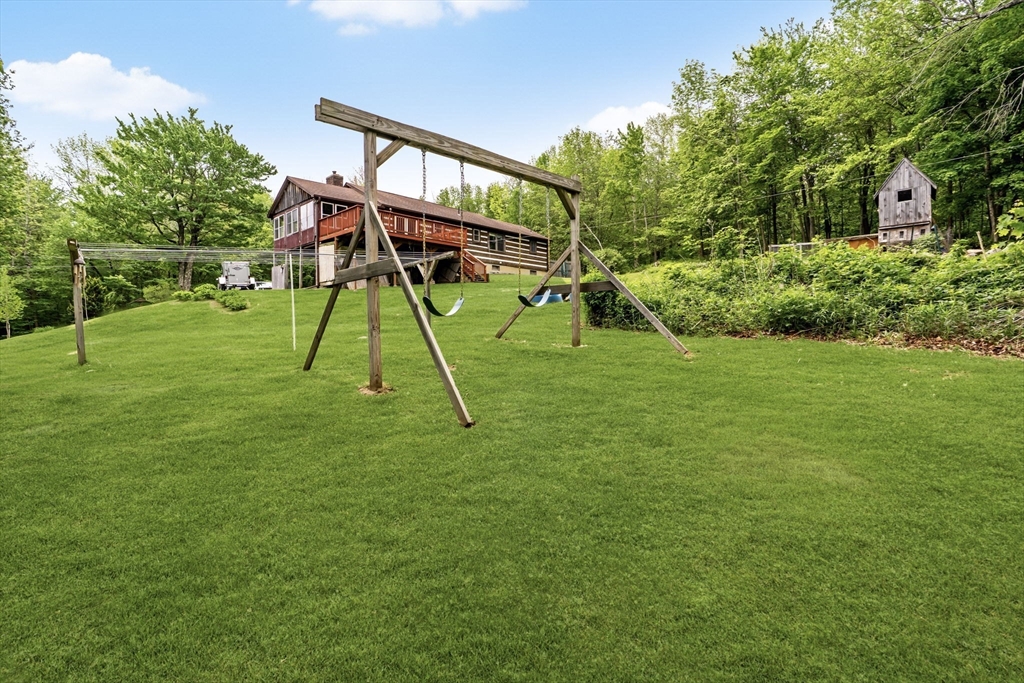 22 Lyon Hill Road Chester, MA 01011 - Photo 10 of 38 a view of a backyard with a slide
