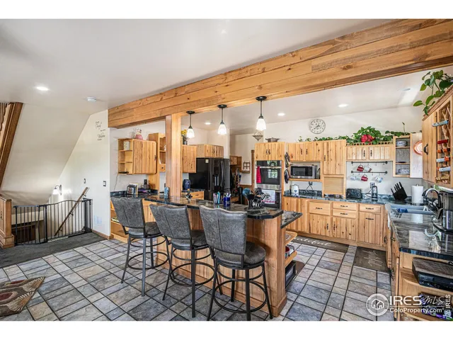 a living room with lots of furniture and a view of dining table