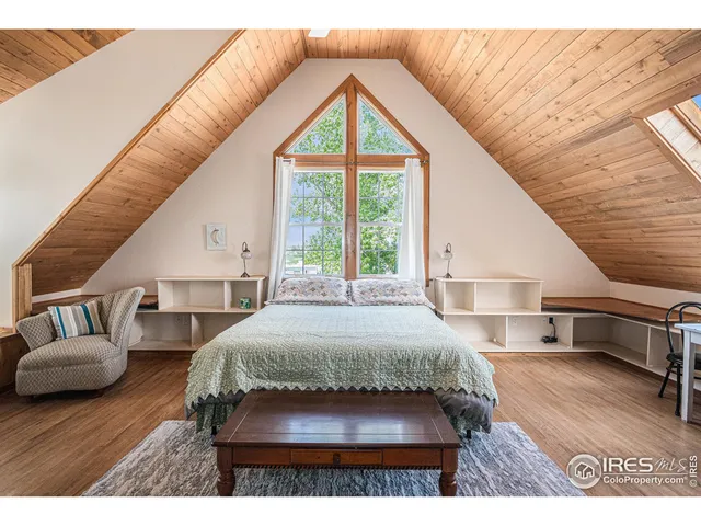a en suite bathroom with a sink and a large window