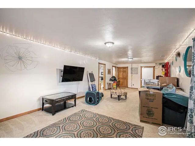 a kitchen with stainless steel appliances kitchen island granite countertop a sink dishwasher stove and cabinets