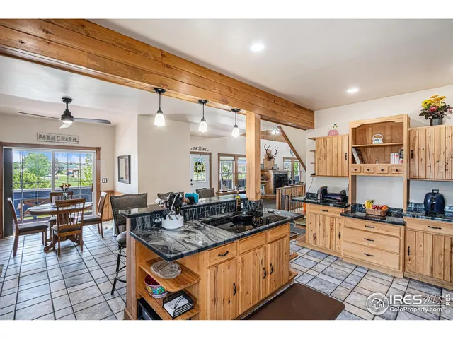 a open kitchen with stainless steel appliances granite countertop a sink and cabinets