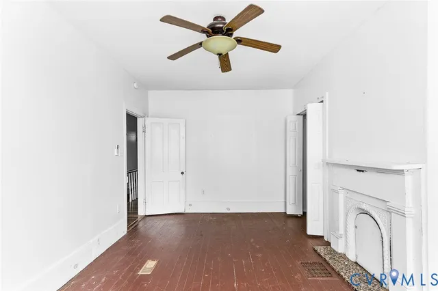 a view of a livingroom with a ceiling fan and a rug