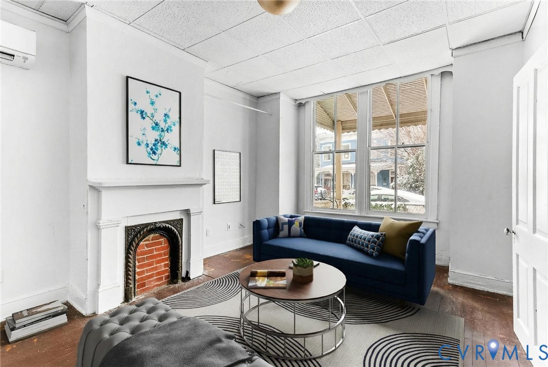 607 South Laurel Street Richmond, VA 23220 - Photo 2 of 14 a living room with furniture a rug and a fireplace