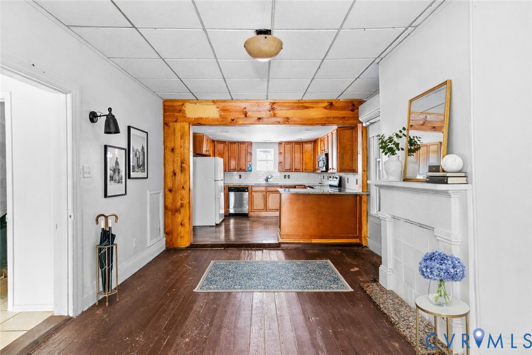 607 South Laurel Street Richmond, VA 23220 - Photo 4 of 14 a kitchen with kitchen island a counter top space a sink and stainless steel appliances