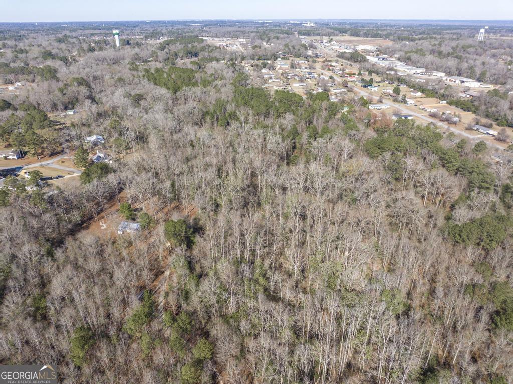 42.5 Old Perry Road Bonaire, GA 31005 - Photo 13 of 17 an aerial view of residential houses with outdoor space and trees