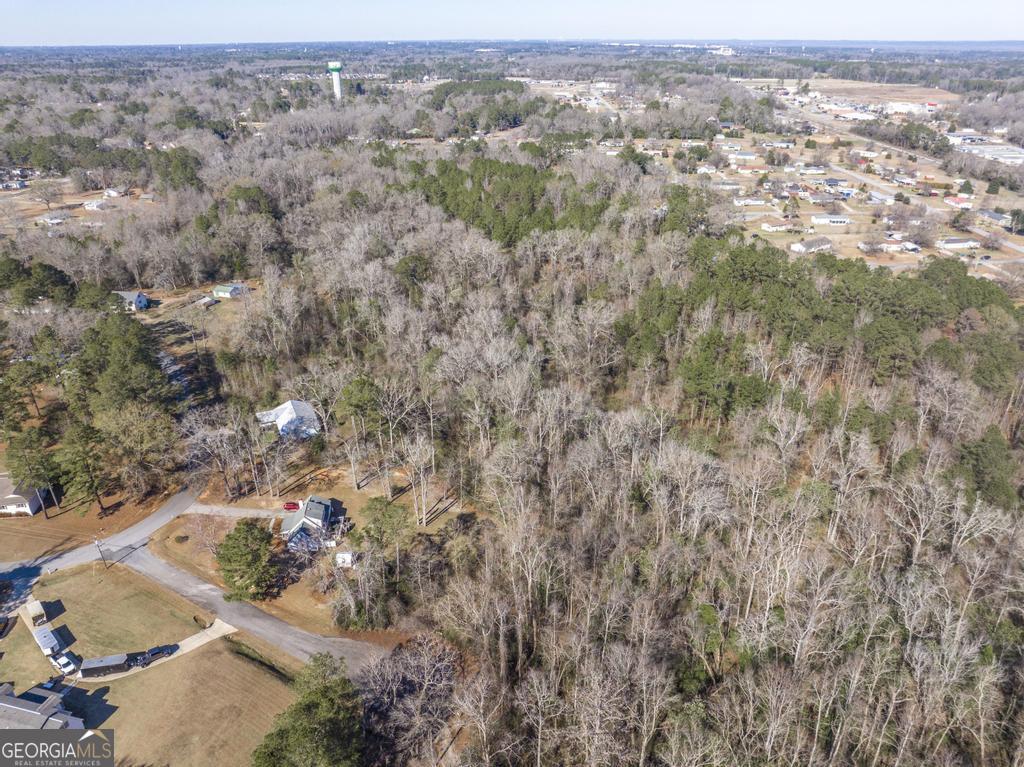 42.5 Old Perry Road Bonaire, GA 31005 - Photo 14 of 17 an aerial view of house with yard and mountain view in back