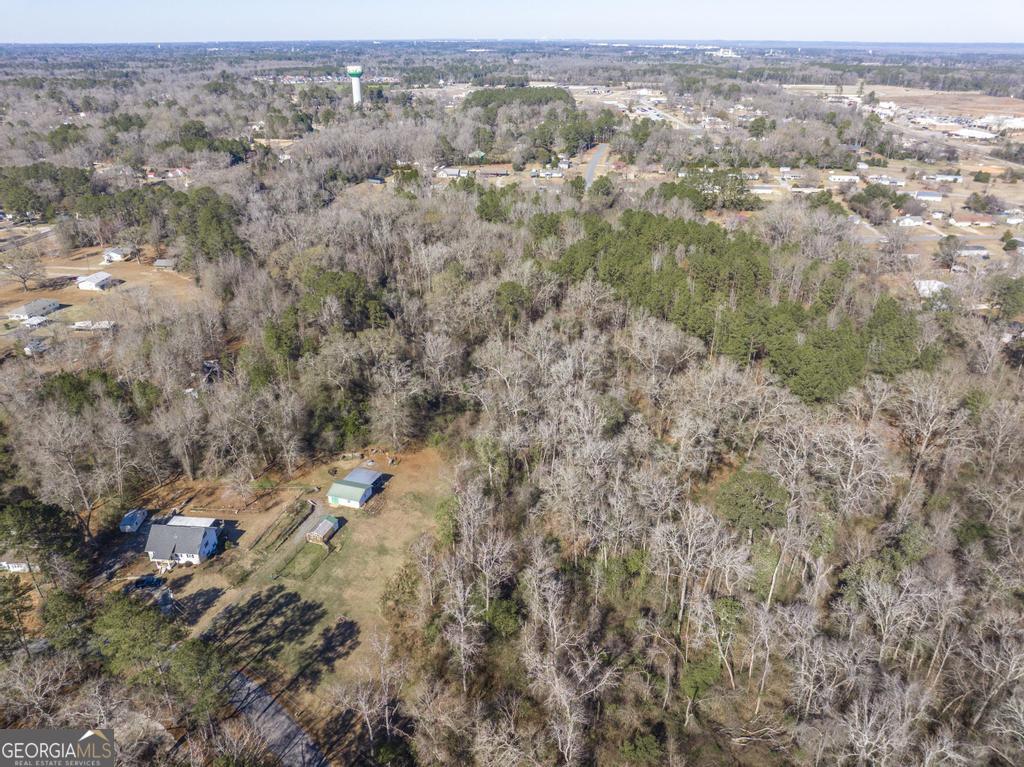 42.5 Old Perry Road Bonaire, GA 31005 - Photo 15 of 17 an aerial view of residential houses with outdoor space and trees