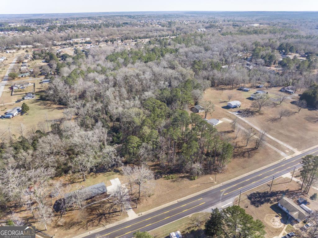 42.5 Old Perry Road Bonaire, GA 31005 - Photo 3 of 17 an aerial view of house with yard