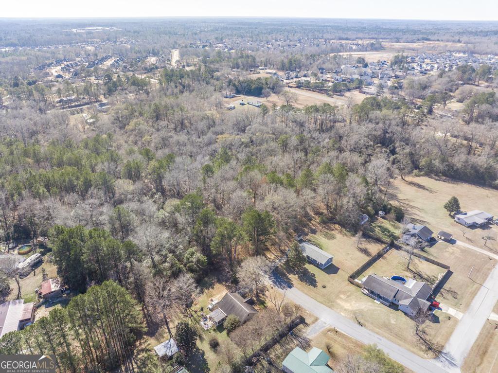 42.5 Old Perry Road Bonaire, GA 31005 - Photo 6 of 17 an aerial view of a city with lots of residential buildings