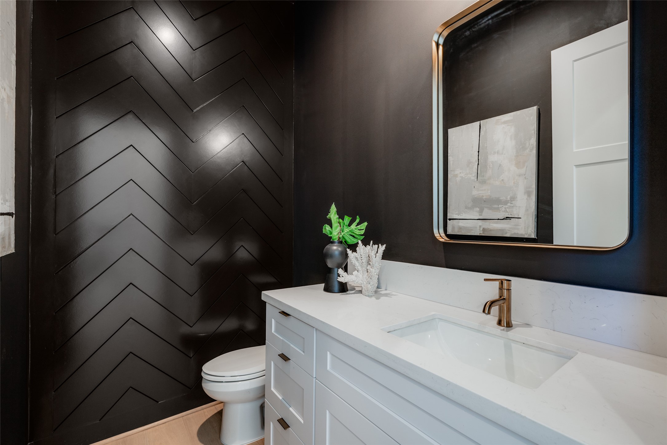 2015 Hopkins Street Houston, TX 77006 - Photo 31 of 50 a bathroom with a sink and mirror with toilet