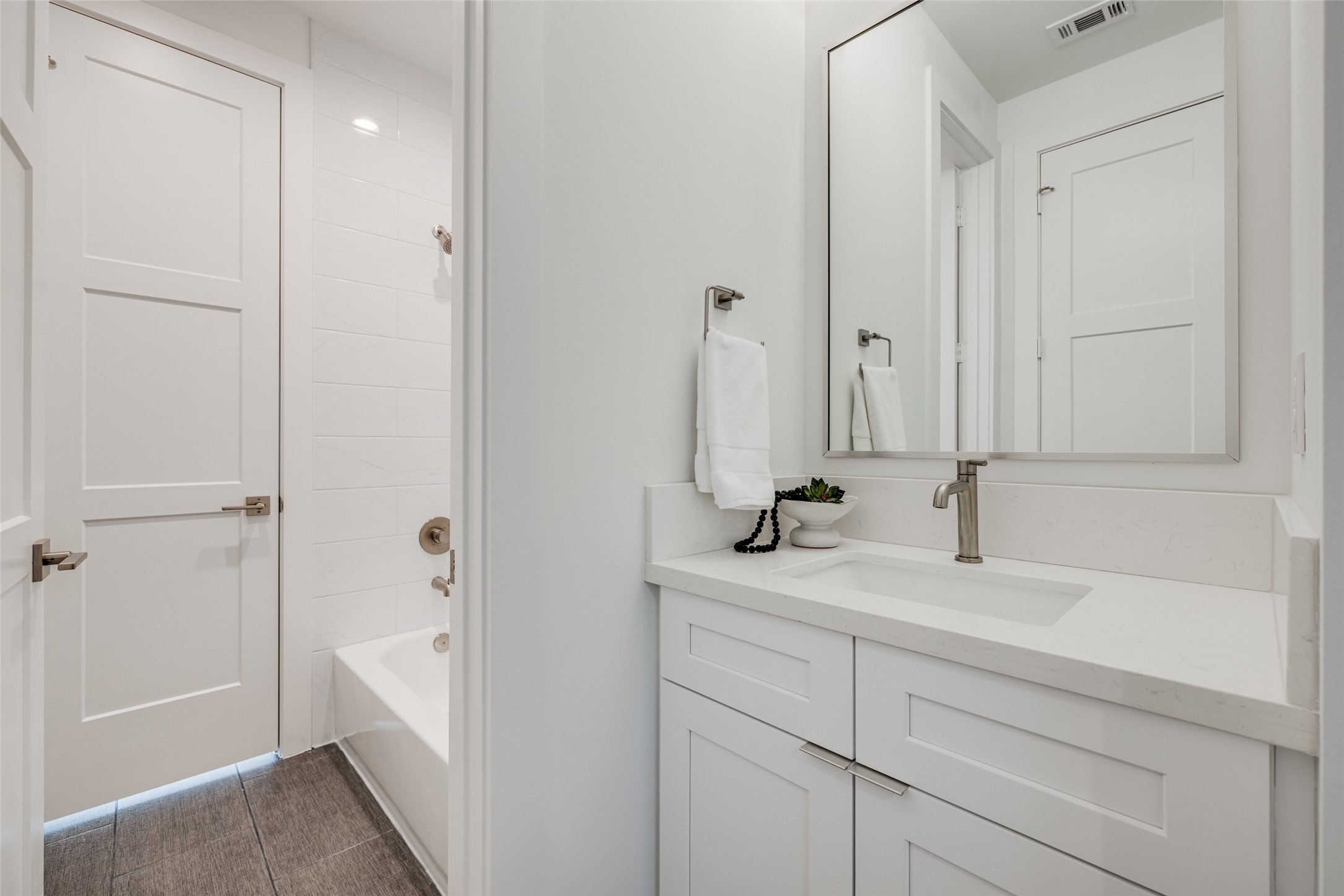 2015 Hopkins Street Houston, TX 77006 - Photo 34 of 50 a bathroom with a sink and a mirror with bathtub