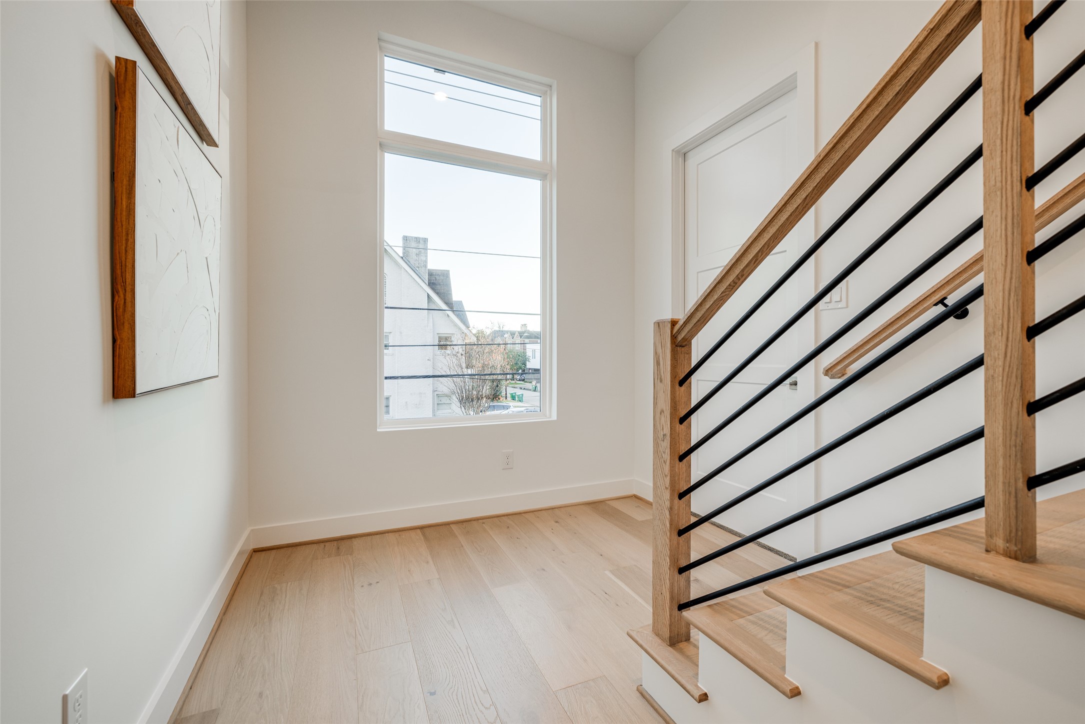 2015 Hopkins Street Houston, TX 77006 - Photo 35 of 50 a view of an entryway with wooden floor and stairs