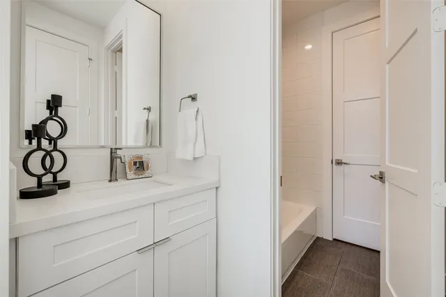 a view of entryway and kitchen with a sink