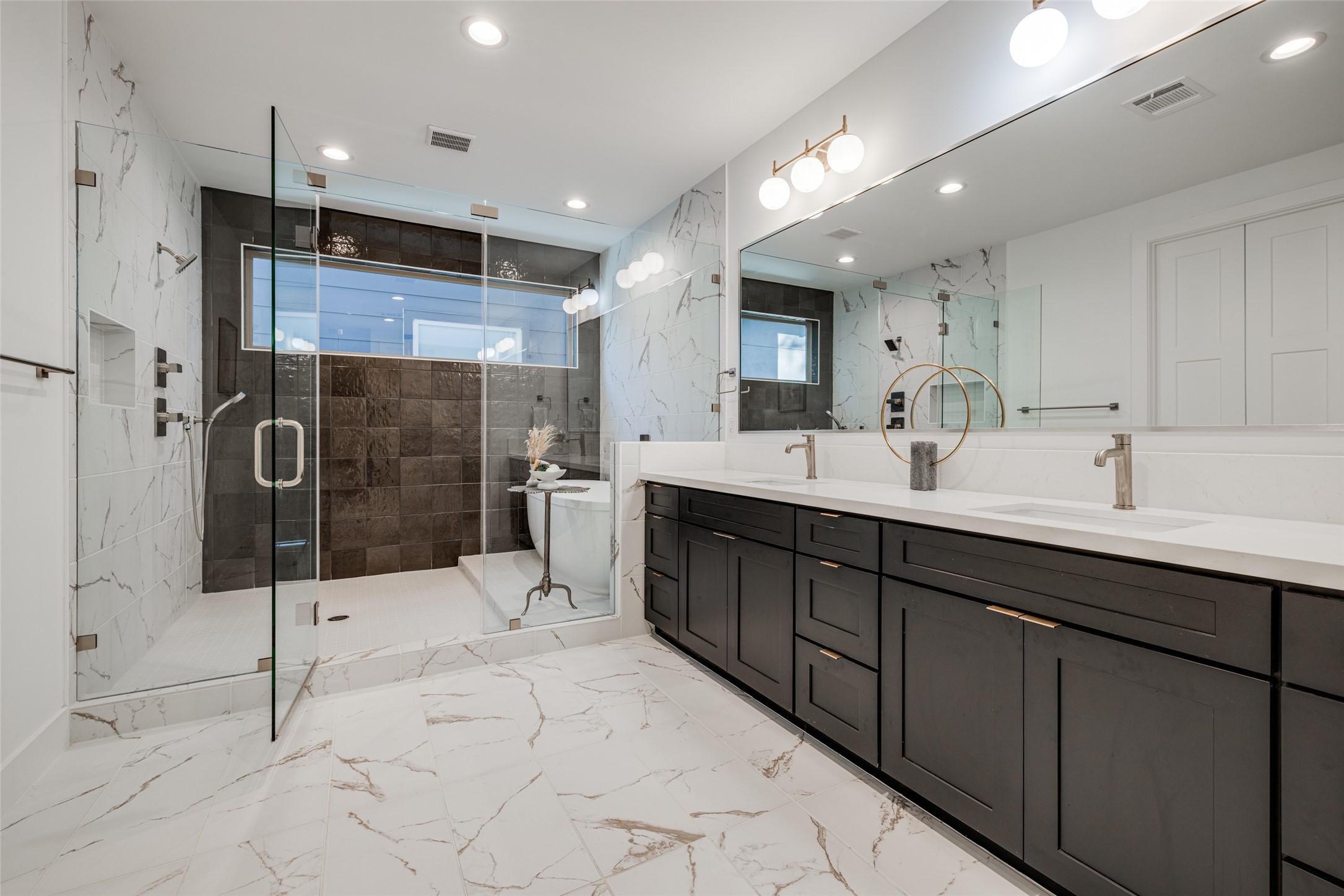 2015 Hopkins Street Houston, TX 77006 - Photo 39 of 50 a large bathroom with a sink mirror and shower