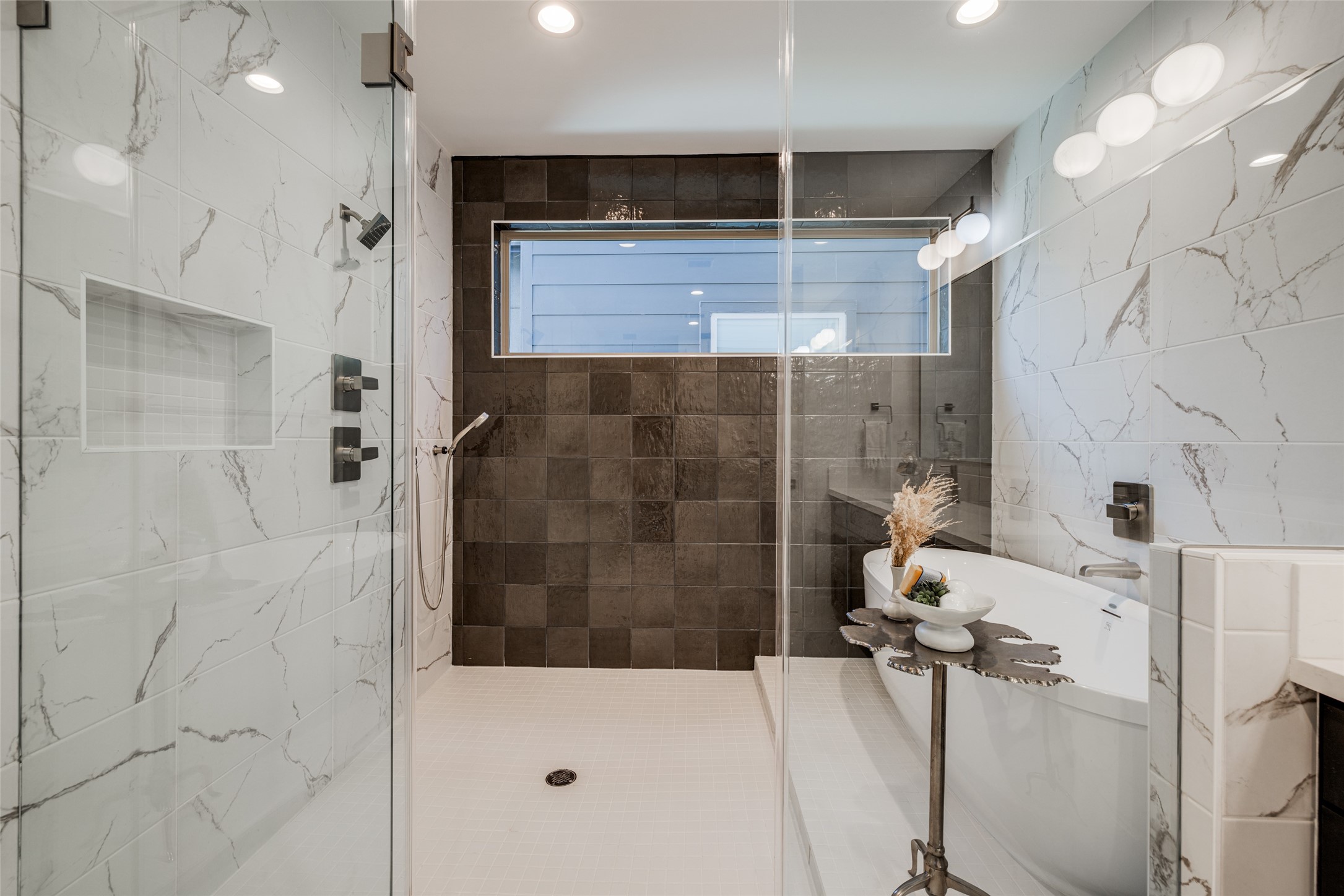 2015 Hopkins Street Houston, TX 77006 - Photo 40 of 50 a bathroom with a shower and a sink