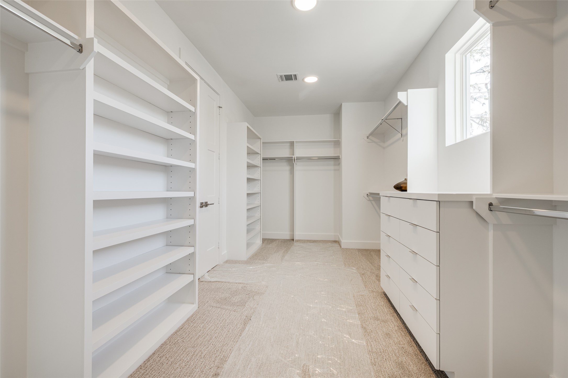 2015 Hopkins Street Houston, TX 77006 - Photo 43 of 50 a view of walk in closet with empty racks