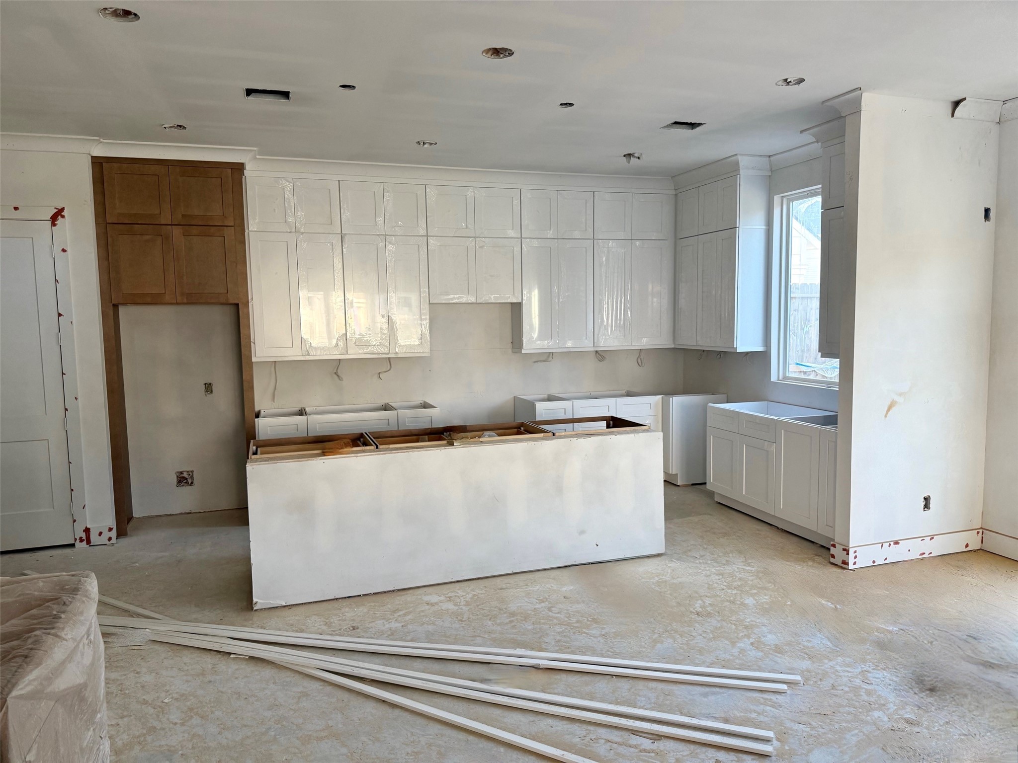 2015 Hopkins Street Houston, TX 77006 - Photo 5 of 50 a kitchen with white cabinets and window