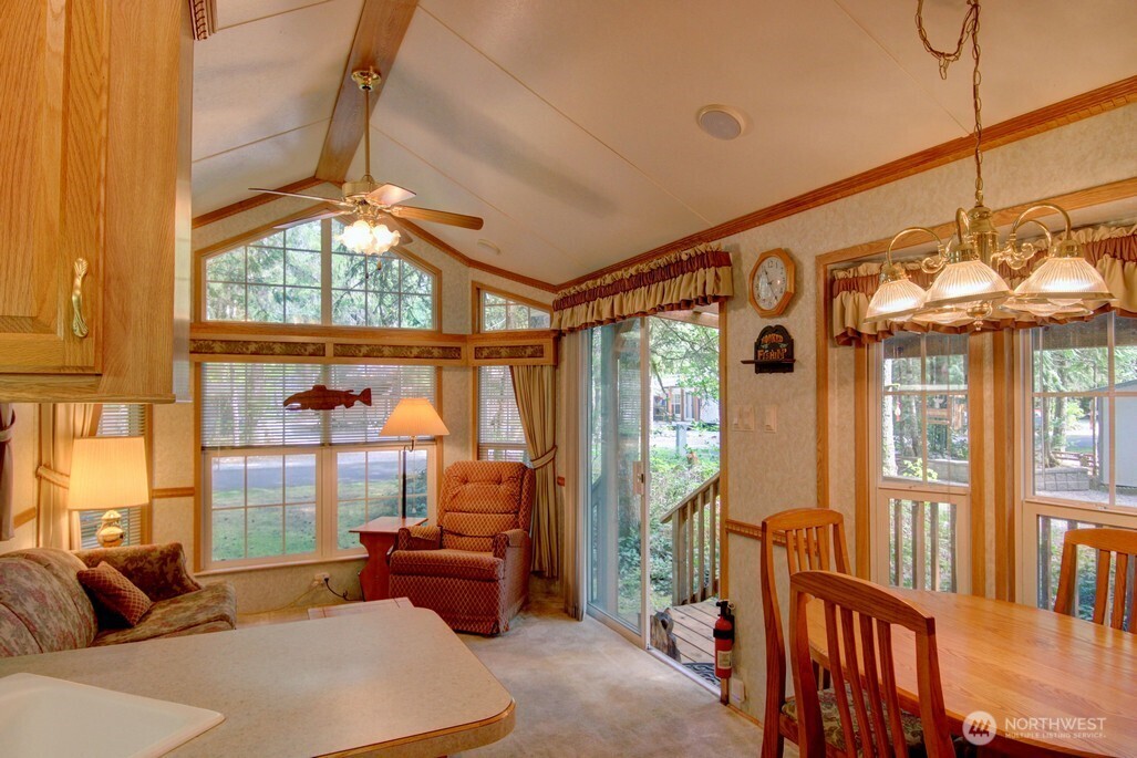 134 Drial Loop Maple Falls, WA 98266 - Photo 8 of 36 a living room with furniture a ceiling fan and a large window