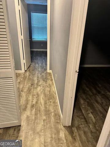 a view of an empty room with a window