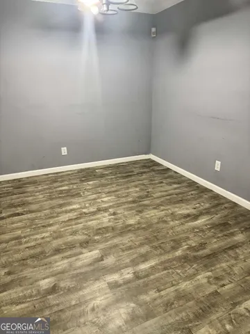 a view of empty room with an entryway