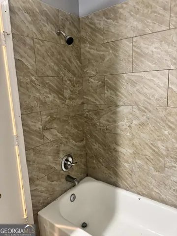 a bathroom with a bathtub