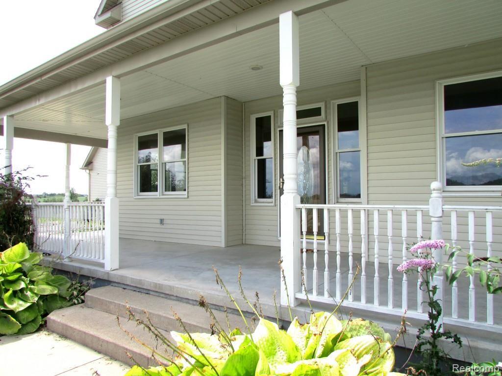 1699 Horton Lake Road Lapeer, MI 48446 - Photo 51 of 54 Front of Wrap-Around Porch