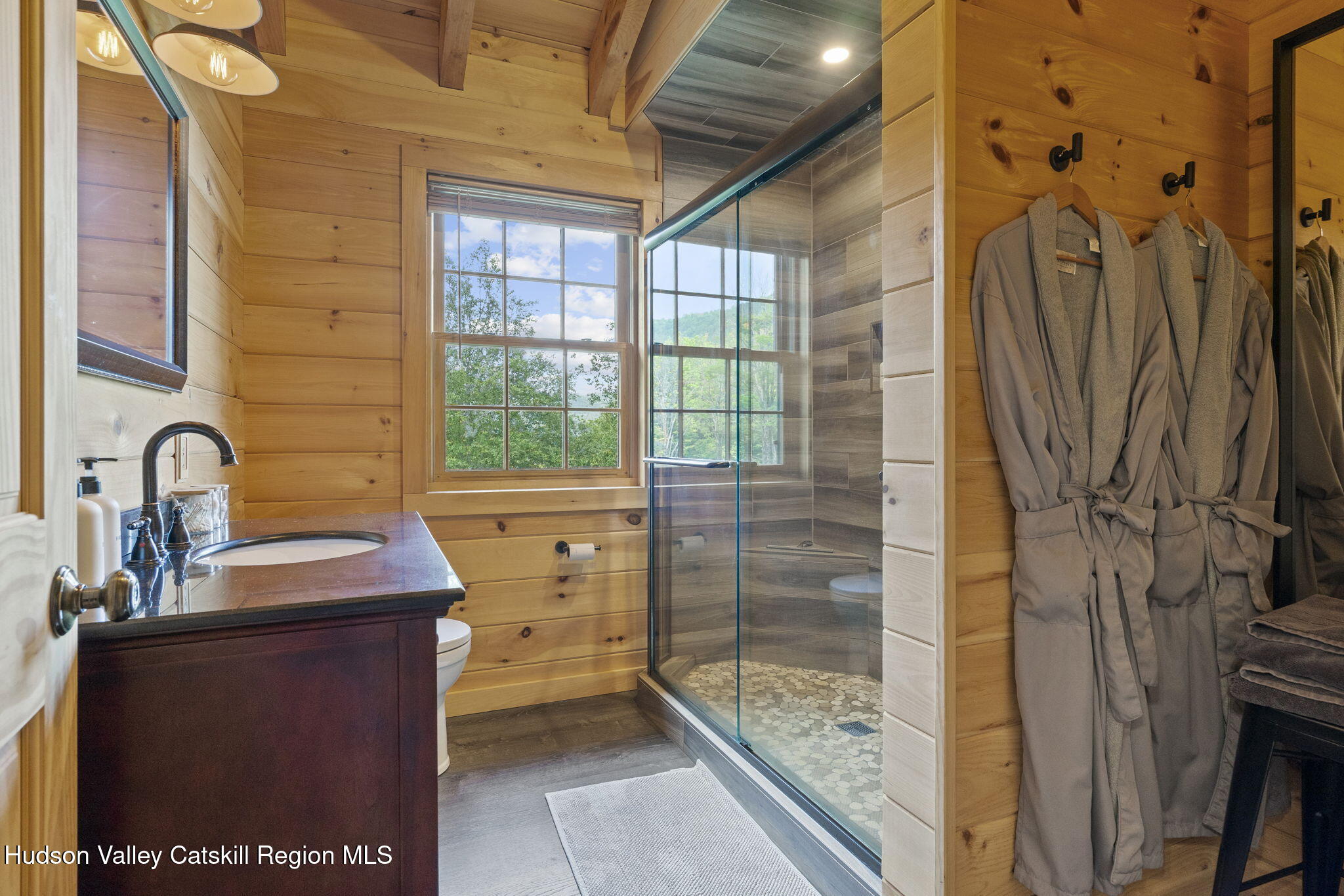 892 Durham Road Gilboa, NY 12076 - Photo 20 of 45 a bathroom with a sink a mirror and a shower