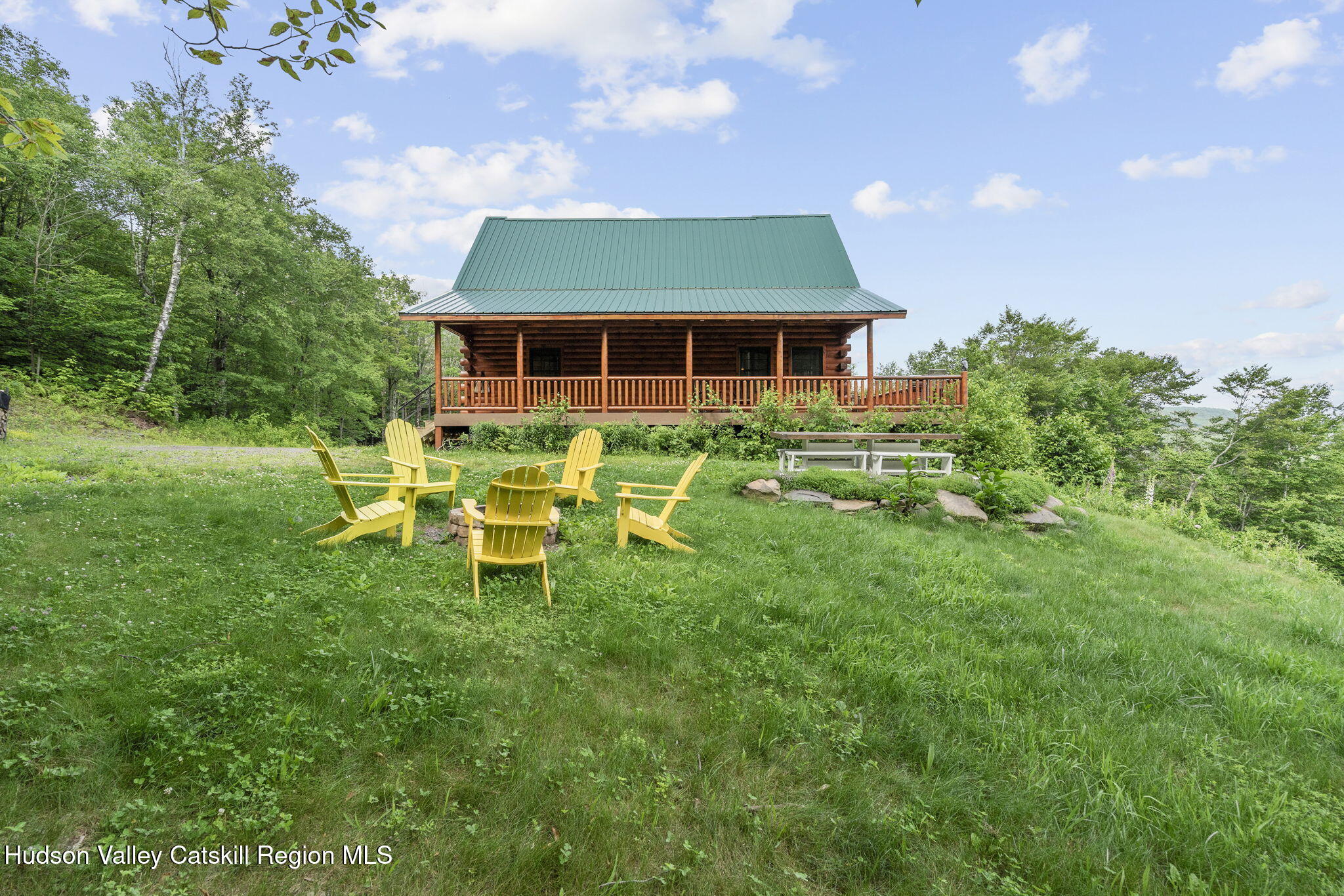 892 Durham Road Gilboa, NY 12076 - Photo 34 of 45 a front view of a house with a yard table and chairs