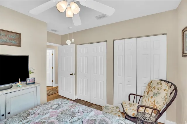 a swimming pool with outdoor seating and yard