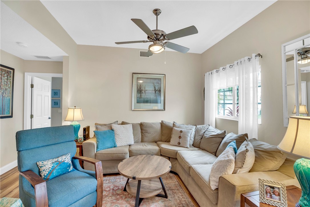 532 7th Square Southwest, Unit 101 Vero Beach, FL 32962 - Photo 8 of 33 a living room with furniture and a ceiling fan