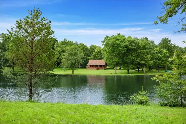a view of a lake with a yard