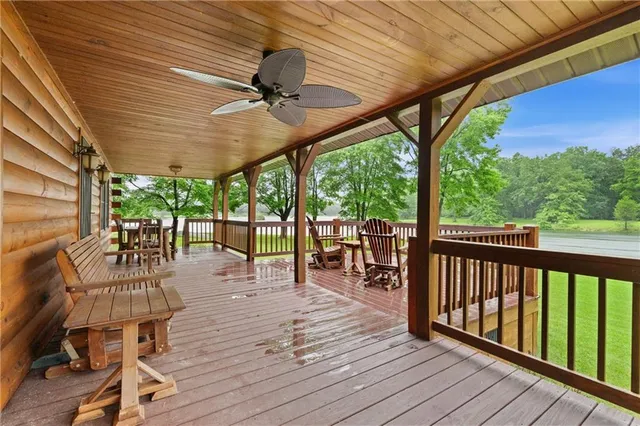a view of balcony with wooden floor and outdoor seating