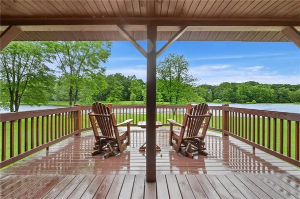 a view of a lake with a house in the background