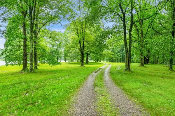 a view of a lake with a big yard