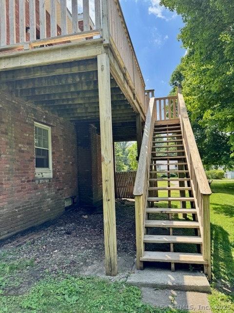 153 Main Street, Unit 2 East Hampton, CT 06424 - Photo 23 of 33 Stairs leading to the deck from the back yard