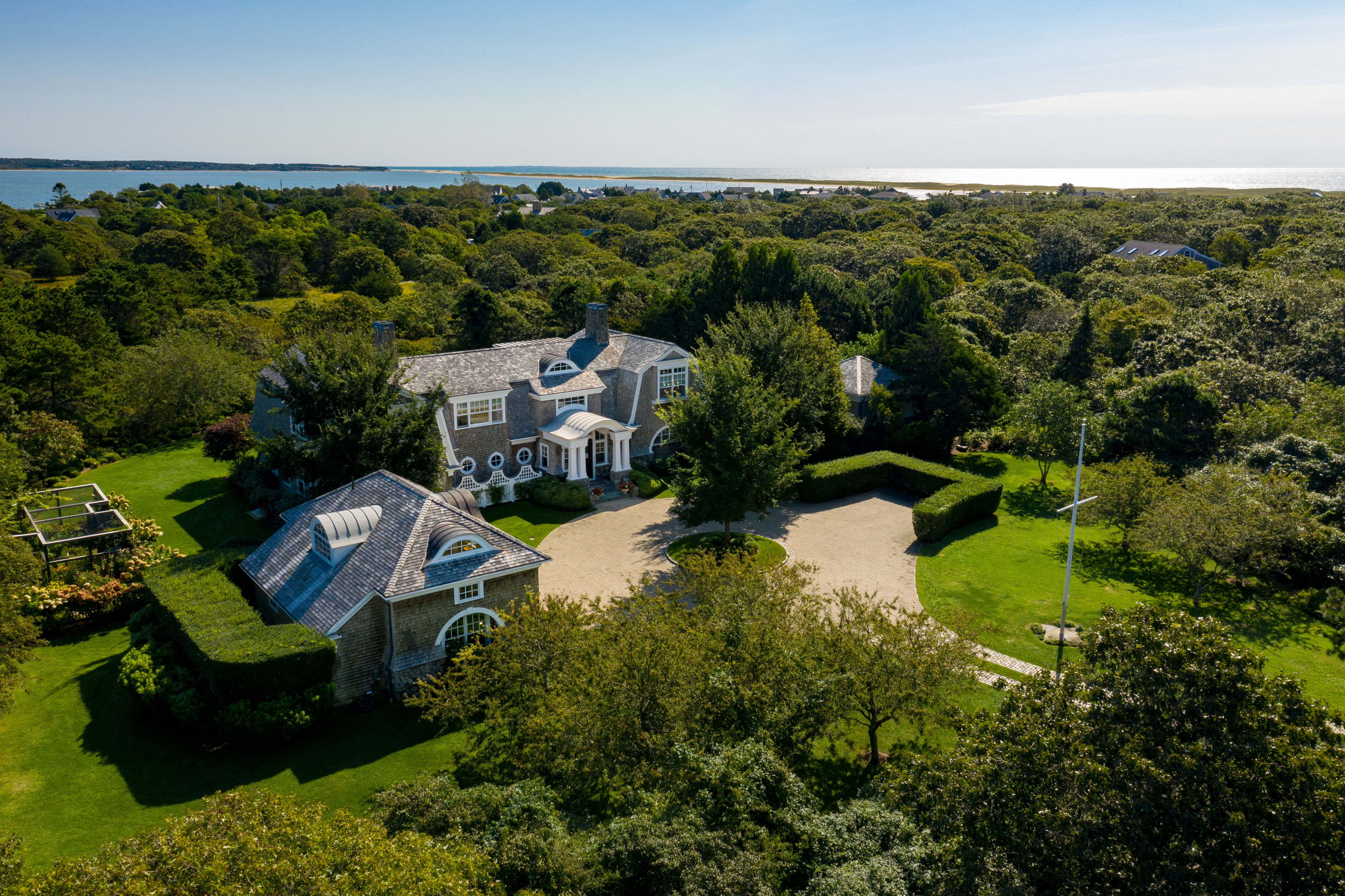 an aerial view of a house with yard swimming pool and outdoor seating