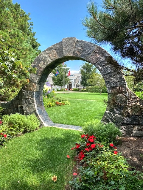 3 Katama Bay View Road Edgartown, MA 02539 - Photo 19 of 50 a view of a garden with large tree and a wooden fence