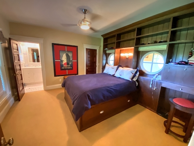 3 Katama Bay View Road Edgartown, MA 02539 - Photo 22 of 50 a bedroom with a bed and dresser with mirror