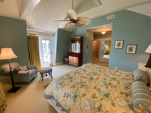 3 Katama Bay View Road Edgartown, MA 02539 - Photo 30 of 50 a bedroom with a bed and dresser with mirror