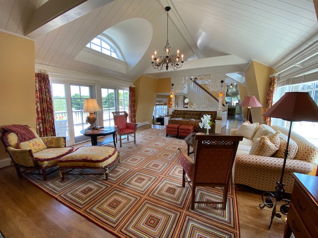 3 Katama Bay View Road Edgartown, MA 02539 - Photo 34 of 50 a living room with furniture a chandelier and a fireplace