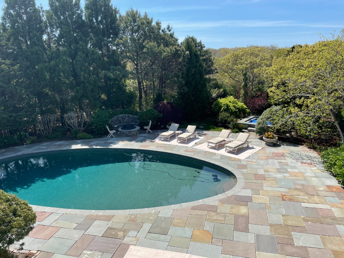 3 Katama Bay View Road Edgartown, MA 02539 - Photo 9 of 50 a view of pool with lawn chairs and plants