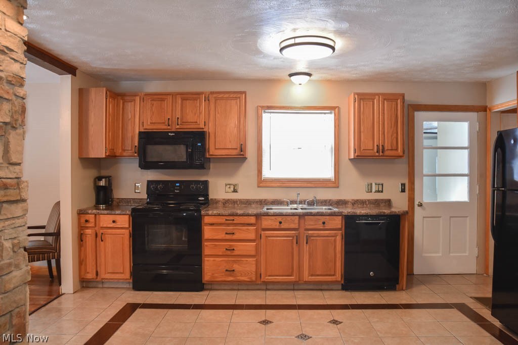 973 Mishler Road Mogadore, OH 44260 - Photo 4 of 20 The kitchen has tile flooring.