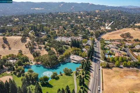 an aerial view of residential house and green space