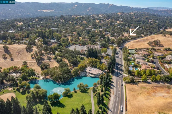 an aerial view of residential house and green space
