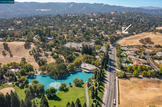 an aerial view of residential house and green space