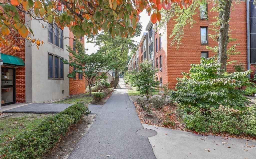 32 Juniper Street, Unit 98 Brookline, MA 02445 - Photo 16 of 17 a view of a pathway with a house on both side