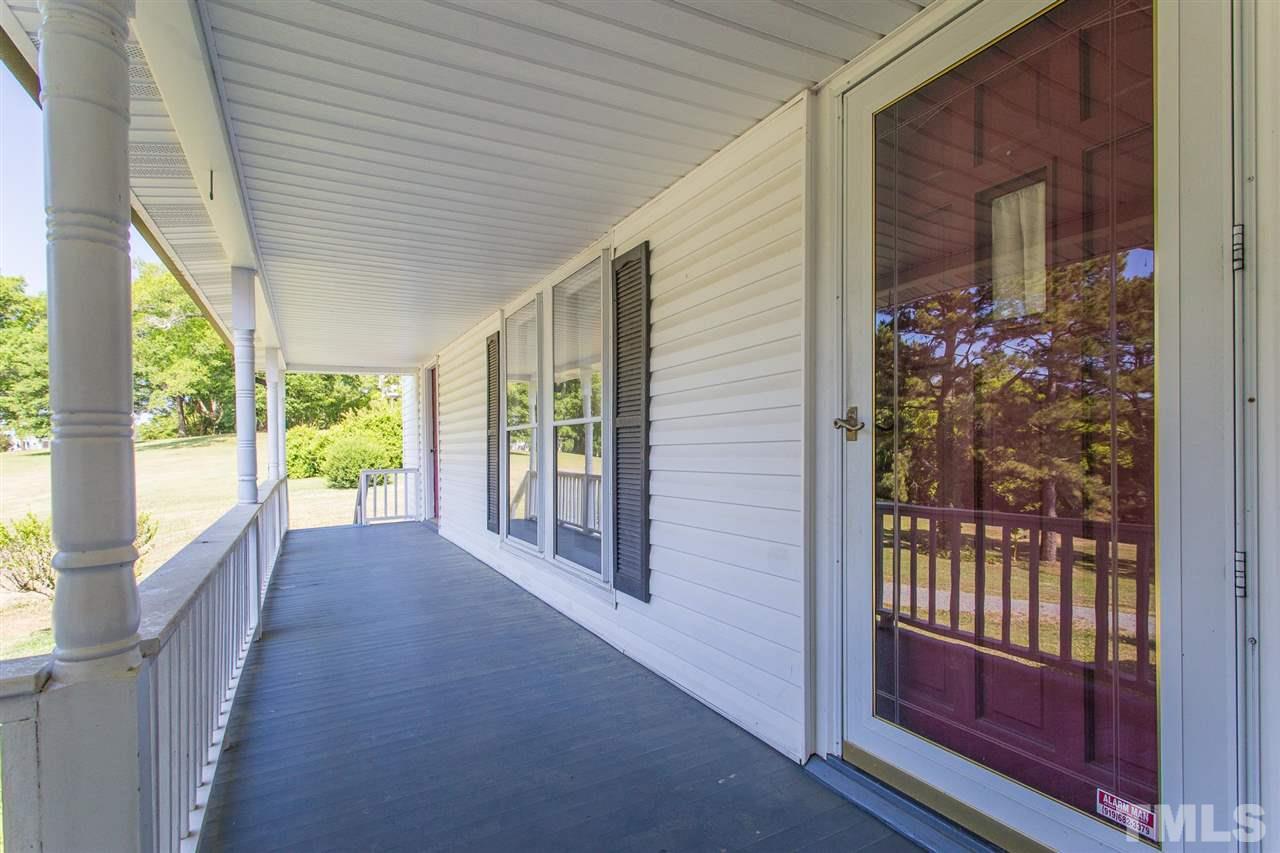 245 Durham Eubanks Road Pittsboro, NC 27312 - Photo 5 of 30 Over 65' of front porch...