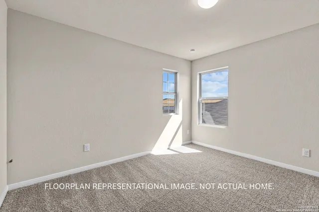 a view of a room with wooden floor and windows