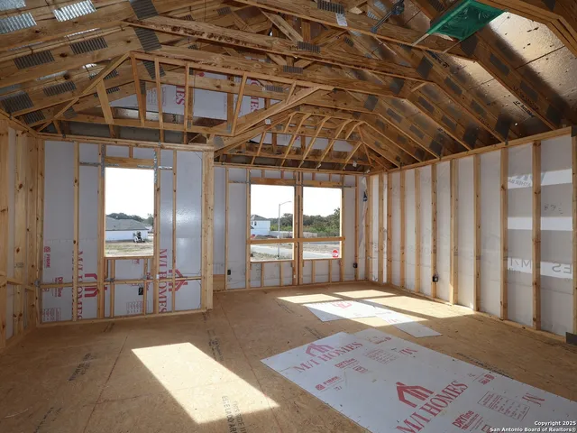 a view of a room with wooden walls