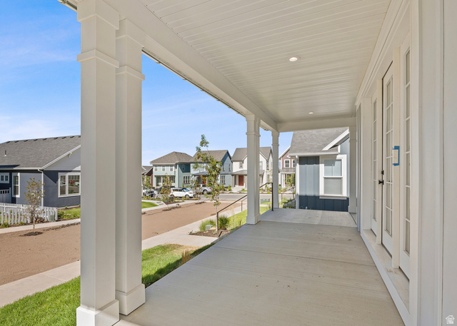 11214 South Easy Bee Road, Unit 270 South Jordan, UT 84009 - Photo 8 of 31 Inviting covered front porch with substantial white architectural columns, recessed lighting, and a concrete surface